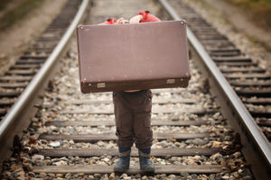 child with suitcase