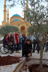 Planting the tree at the Garden of Forgiveness