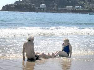 Alastair and Marilyn play on the beach in Jersey